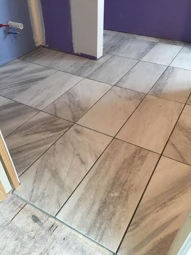 Marble bathroom flooring in Dearborn, MI from Roman Floors & Remodeling